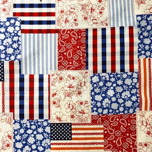 May include: A patchwork textile featuring squares with patriotic patterns. Designs include the American flag, red and white stripes, blue floral prints, and red paisley. The color palette is red, white, and blue.