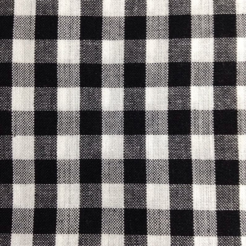 May include: Black and white checkered fabric with a woven texture.