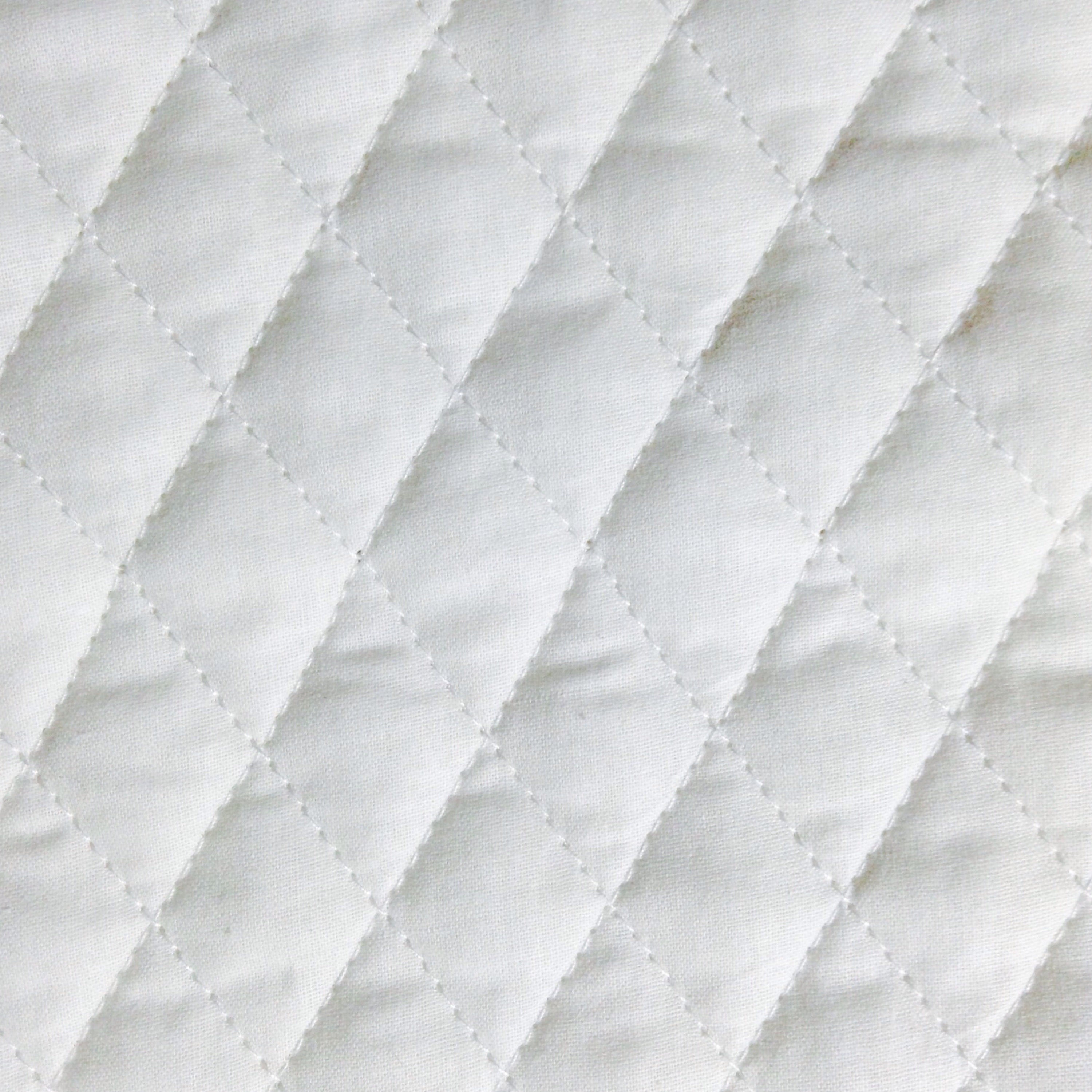 White cheap quilted fabric