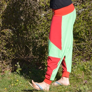 May include: A pair of green and red pants with a unique geometric design. The pants are made of a soft, comfortable fabric and have a relaxed fit.