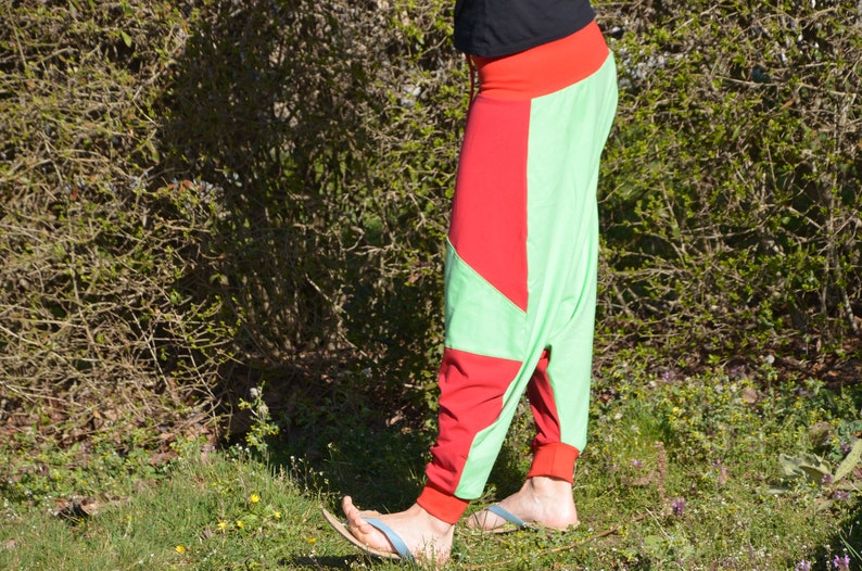May include: A pair of green and red pants with a unique geometric design. The pants are made of a soft, comfortable fabric and have a relaxed fit.