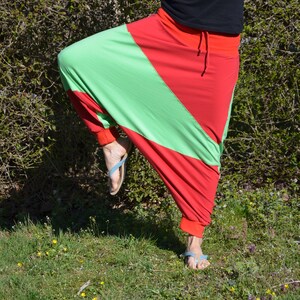 May include: A pair of red and green pants with a unique design. The pants are made of a soft, stretchy fabric and have a comfortable fit.