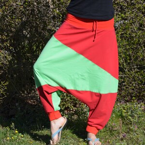 May include: Red and green harem pants with a drawstring waist.