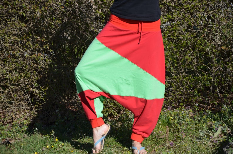 May include: Red and green harem pants with a drawstring waist.