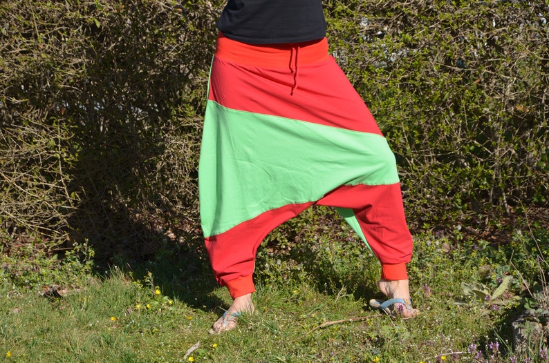 May include: Red and green striped pants with a wide leg and a drawstring waist.