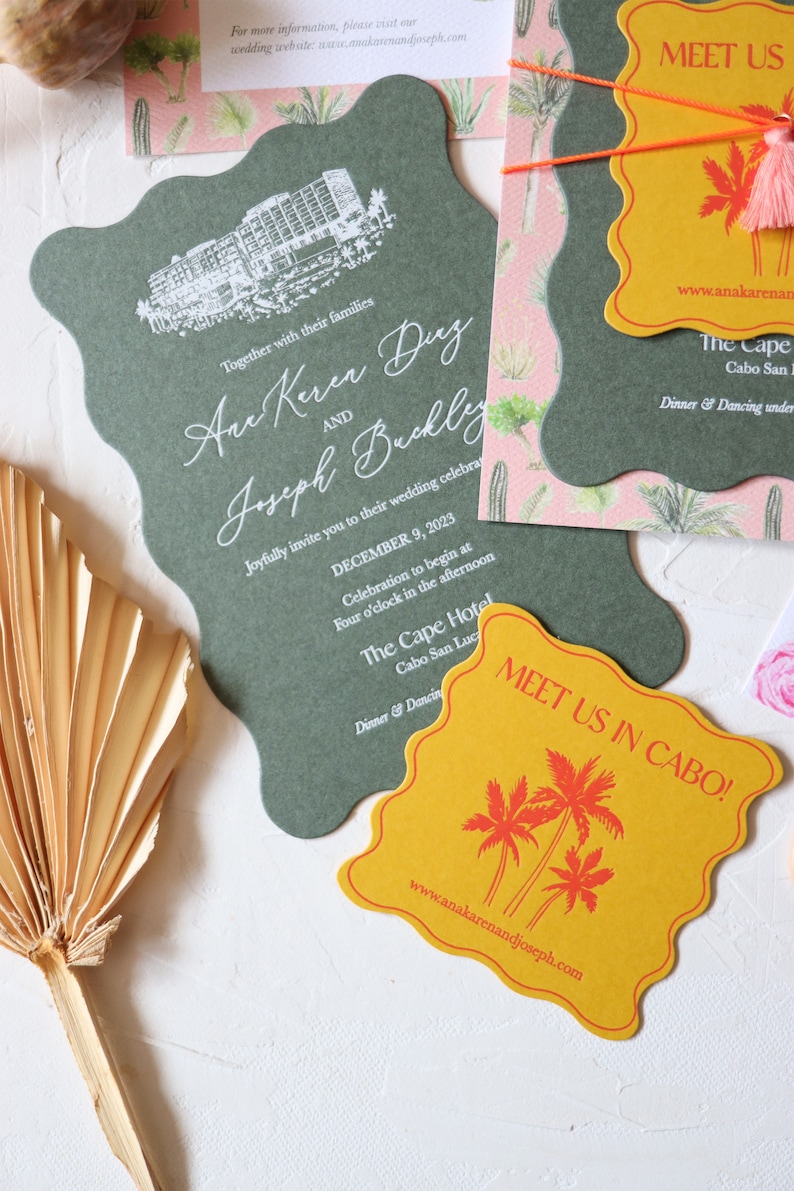 May include: A green and white wedding invitation with a stylized illustration of a hotel building. The invitation includes the names "Ane Keren Duy" and "Joseph Buckly" and the date "December 9, 2023". A yellow card with palm trees and the text "Meet us in Cabo!" is also included.