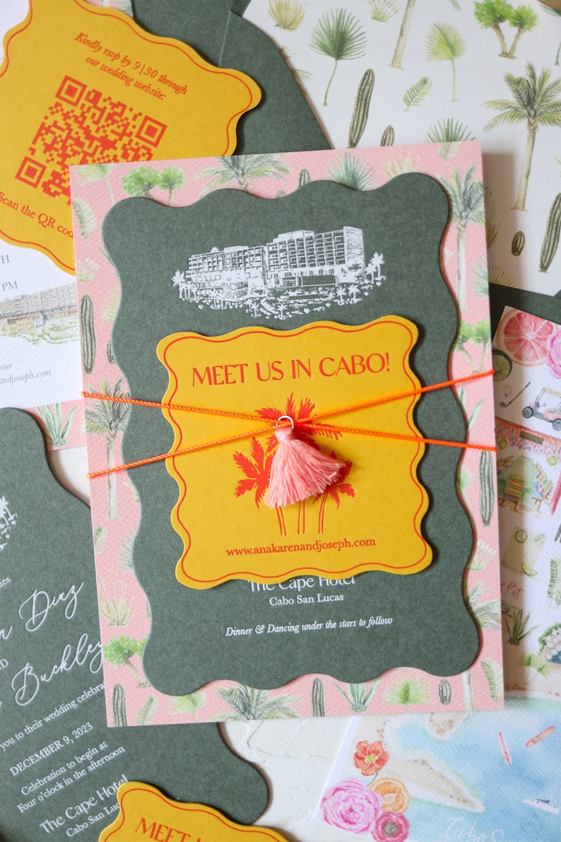 May include: A yellow and orange invitation with a tassel, featuring the text "Meet us in Cabo!" and the website address "www.anakarenandjoseph.com". The invitation also includes the text "The Cape Hotel, Cabo San Lucas" and "Dinner & Dancing under the stars to follow".
