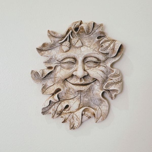 Decorazione murale con volto di uomo su foglia di ghianda, scultura dell'Uomo Verde