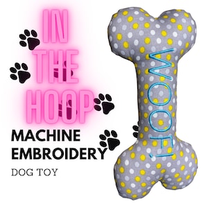 May include: A gray and yellow dog bone toy with white polka dots. The bone has the word "WOOF" embroidered on it in blue thread. The text "IN THE HOOP MACHINE EMBROIDERY DOG TOY" is written in pink on a white background.