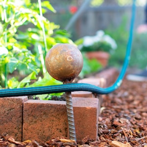 Garden Hose Stake Guides Set of 4 with Spiked Rebar Stakes 3in Diameter Steel Gazing Balls Rusted Patina Finish image 1