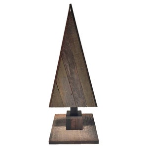 May include: A wooden Christmas tree made from reclaimed wood planks. The tree is brown and has a rustic look. It stands on a square wooden base.