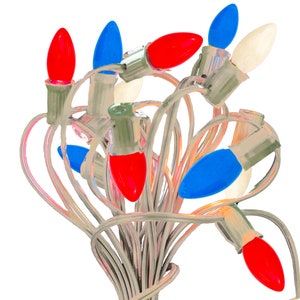 May include: A string of Christmas lights with red, white, and blue bulbs. The lights are tangled together and the wires are visible.