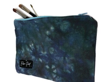 blue tie dye zippered art supply bag, dimensions 7 inches by 10 inches, hand dyed zipper pouch made of recycled fabrics