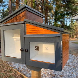 Corten Steel Style 2 level Paperbacks with rusted steel and  varnished horizontal lap siding and charcoal metal roofs