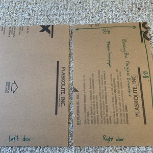 May include: Two brown cardboard sheets with the text "Plaskolite, Inc." and "Optix is a registered trademark of Plaskolite, Inc. for acrylic sheet." The sheet on the right has a green arrow pointing to the text "8" and the text "Blessing Box Plexiglass Dimensions" with the instruction "*Remove brown paper."