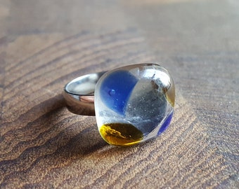 Recycled wine bottle ring kiln-fused from blue, brown, and clear upcycled glass on silver band