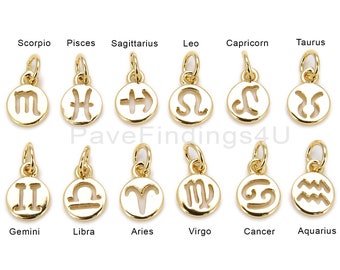 May include: Twelve gold-colored zodiac charms, each featuring a different astrological symbol. The charms are arranged in two rows of six, with the names of each sign written below.
