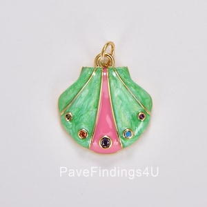 May include: A gold-toned pendant in the shape of a seashell. The pendant features a green and pink enamel design with colorful gemstone accents. The bail is gold-toned.