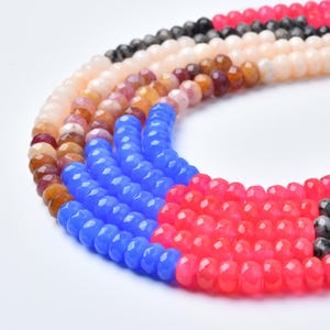 May include: A set of three ceramic mugs with a speckled, matte finish in cream, light grey, and dark grey. Each mug has a simple, minimalist design and a rounded handle.