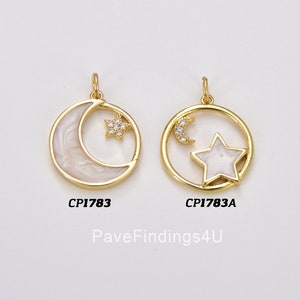 May include: Two gold-tone charms featuring a crescent moon and a star with clear rhinestones. The charm on the left has a white moon and star, while the charm on the right has a white star and a gold moon. The charms are labeled "CP1783" and "CP1783A".