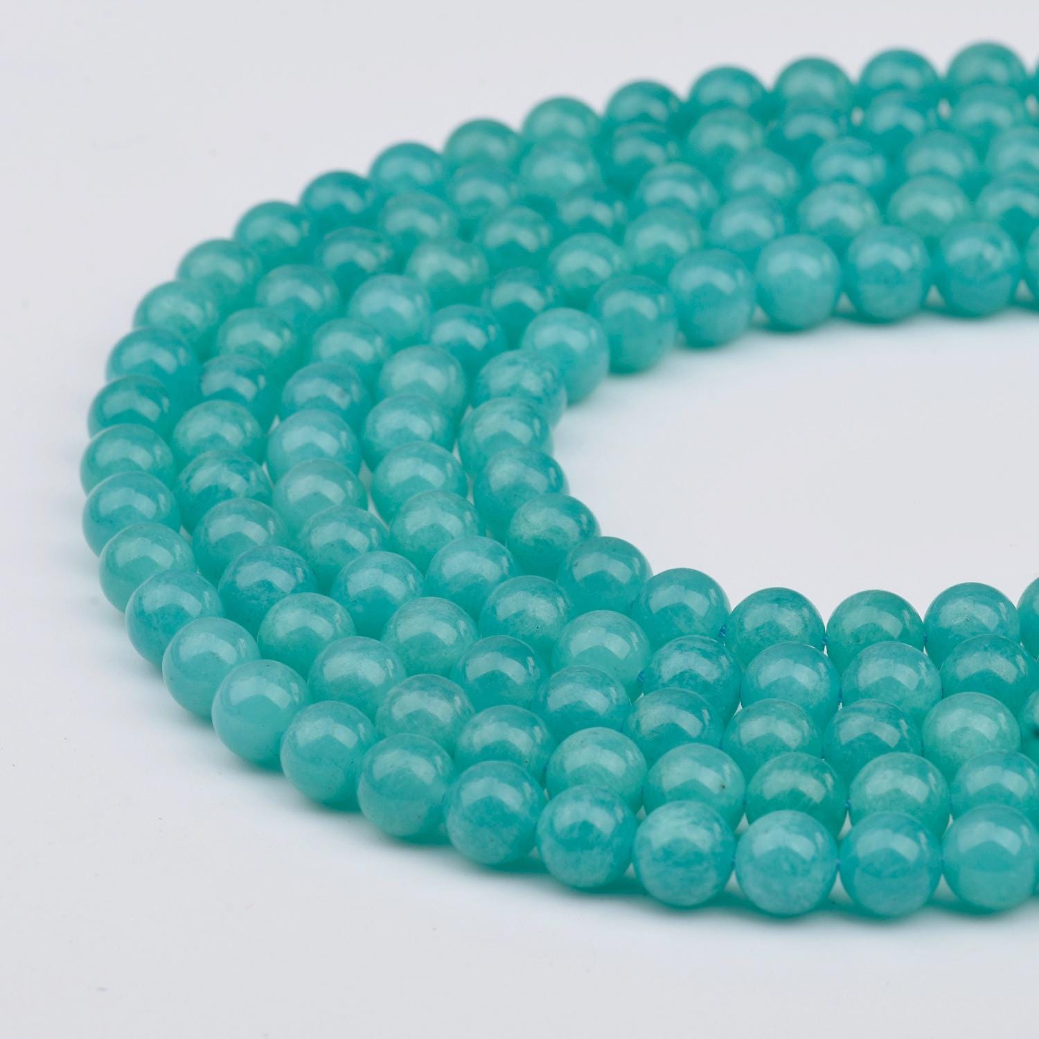 thumbnail interactive-video image 1 of AAA Grade Natural Blue Amazonite Gemstone Beads – 8mm Round, 15-Inch Strand, Center-Drilled, Nickel-Free 1 of 3