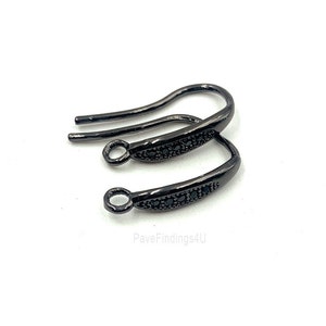 May include: Two black earring hooks with a row of small black stones on each hook.