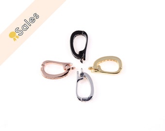 May include: Four different colored metal clasps for jewelry making. The clasps are in black, gold, silver, and rose gold.