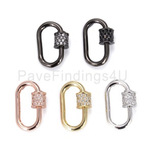 K&ouml;nnte beinhalten: F&uuml;nf Hummerverschl&uuml;sse mit einer Pav&eacute;-Fassung aus klaren Zirkonia-Steinen. Die Verschl&uuml;sse sind in Schwarz, Silber, Gold und Ros&eacute;gold erh&auml;ltlich.