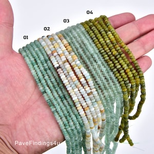 May include: A close-up of ten strands of green gemstone beads, each strand labeled with a number from 01 to 04. The beads are round and have a smooth, polished finish.