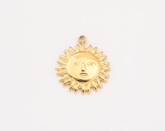May include: A gold-colored sun charm with a face, perfect for adding a touch of whimsy to jewelry projects.