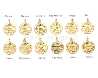 May include: Twelve gold-toned zodiac charms with a hammered texture. Each charm features a different zodiac symbol.