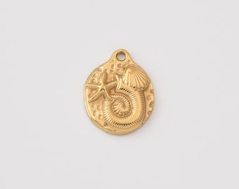 May include: A gold-colored pendant featuring a starfish, seashell, and a spiral shell design. The pendant has a textured background and a small hole at the top for hanging. The overall theme is nautical.
