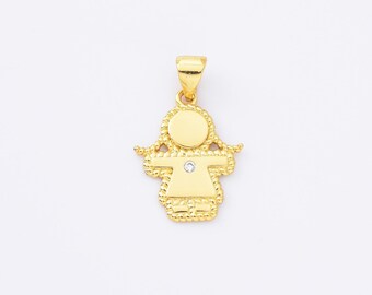 May include: Gold pendant charm in the shape of a girl with a single clear rhinestone in the center. The pendant has a detailed rope-like border.