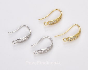 May include: Two pairs of earring hooks with a pave setting of clear cubic zirconia stones. One pair is gold-toned and the other is silver-toned.