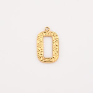 May include: A gold-colored rectangular pendant with a textured surface and a small loop at the top. The pendant has an open center and a decorative pattern. The pendant is likely for jewelry making.