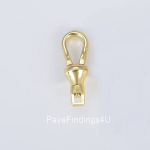 May include: A gold-colored swivel clasp with a rounded top and a rectangular base. The clasp is designed to rotate and connect to other hardware. The image includes the text "PaveFindings4U" at the bottom.