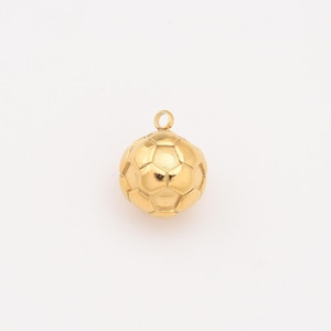 May include: A gold-colored soccer ball pendant with a loop at the top for a chain. The pendant is a detailed replica of a soccer ball, featuring the classic pentagon and hexagon pattern. The pendant is made of a shiny, reflective material.