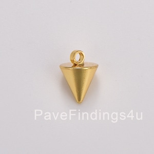 May include: Gold-toned metal pendant shaped like a cone with a loop at the top for attaching to a chain or cord.