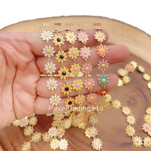 May include: Five strands of gold daisy chain with different colored enamel daisy flowers. The colors are white, black, yellow, pink, and orange. The chain is labeled #01, #02, #03, #04, and #05. The text "PaveFindings4u" is visible below the chains.