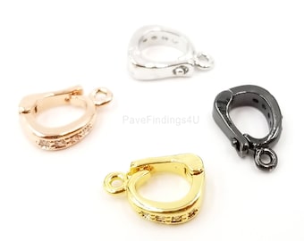 May include: Four different colored metal clasps with clear crystal accents. The clasps are in silver, rose gold, gold, and black.