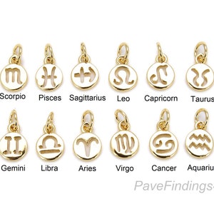 May include: Twelve gold-colored zodiac sign charms, each with a different astrological symbol. The charms are arranged in two rows of six, with the names of the signs written below each charm.