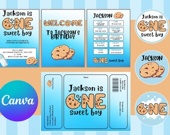 Op de afbeelding: Een set printbare feestversieringen voor een eerste verjaardag. De versieringen zijn in de kleuren blauw en wit en hebben een koekjes-thema. De tekst op de versieringen luidt "Jackson is één jaar, een schattig jongetje".