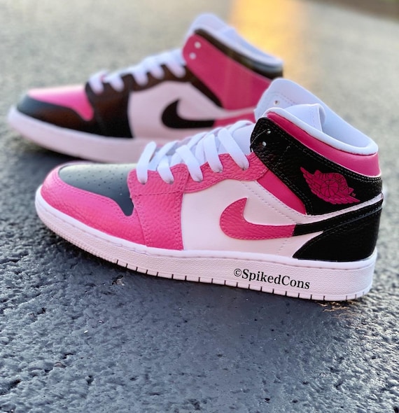 pink black and white jordans low top