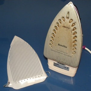 Iron Cover TEFLON iron soleplate cover Universal designed to fit most irons. Very easy to fit in seconds!! Protects your iron soleplate.