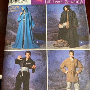 May include: A sewing pattern for four different costumes. The pattern includes a blue hooded robe, a black hooded robe, a black and white martial arts outfit, and a brown robe with a belt. The pattern is for teens and adults and is from Simplicity.