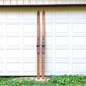 May include: A set of three ceramic mugs with a speckled, matte finish. The mugs are in shades of cream, light gray, and dark gray. Each mug has a simple, minimalist design, perfect for coffee or tea.