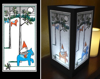May include: A white paper lampshade with a black frame features a whimsical illustration of a gnome riding a blue horse in a forest setting. The illustration includes pine trees, a full moon, and other gnomes riding horses.