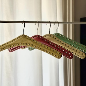 Set of 4 vintage skai hangers with silver and gold studs. Mid-century. Germany, 1960s