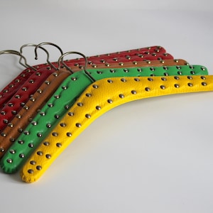 Set of 5 vintage skai hangers with silver and gold studs. Mid-century. Germany, 1960s
