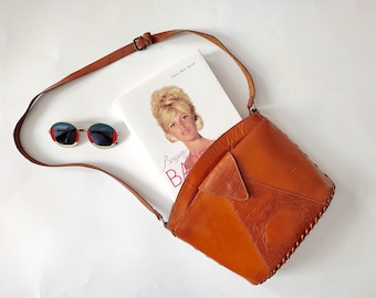 Vintage brown leather bag with a long handle. 90s